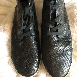 Tom's high tops black “gator” type shoes